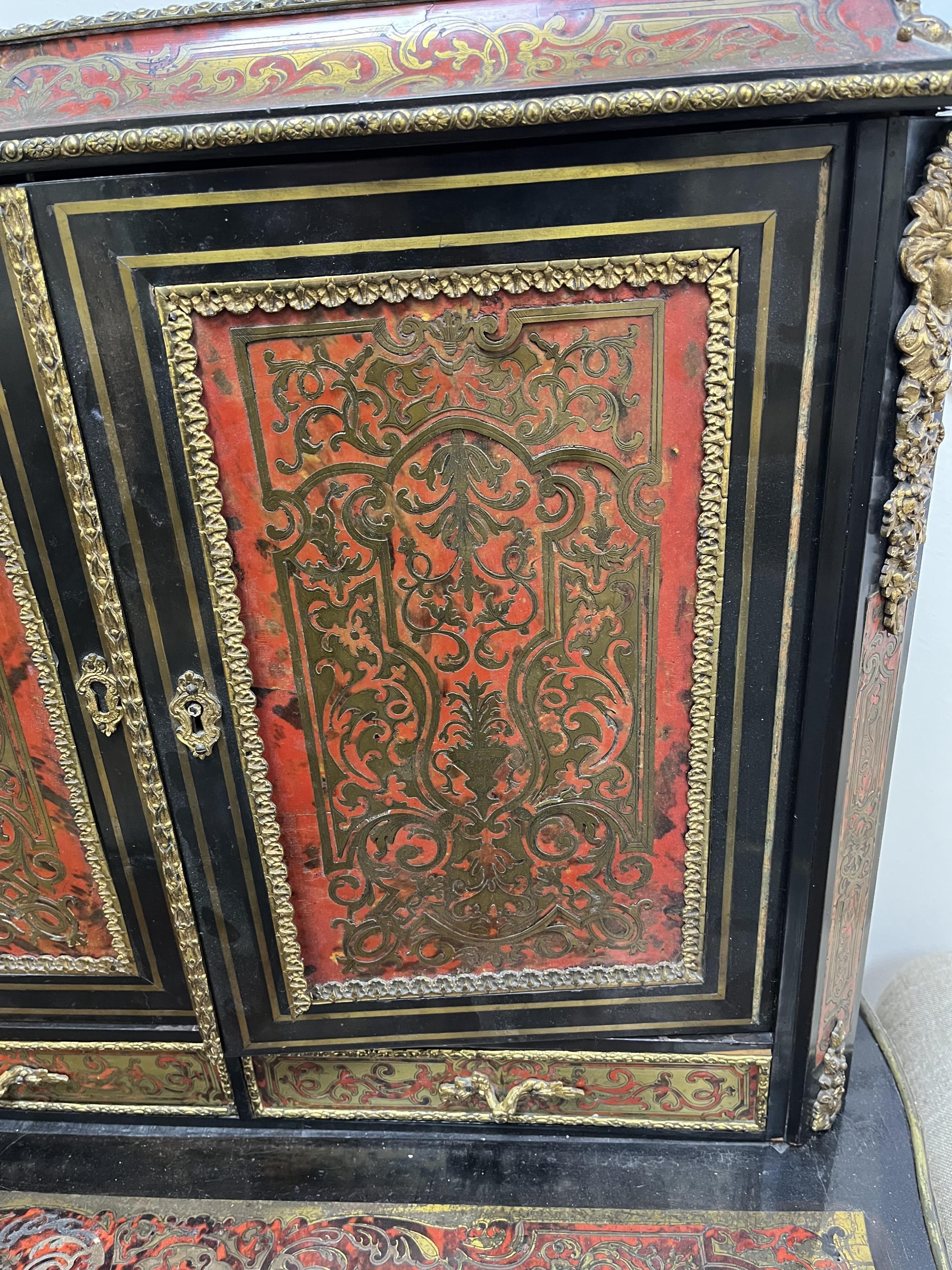 A 19th century French ebonised boulle bonheur du jour, width 75cm, depth 49cm, height 129cm. Condition - poor to fair
